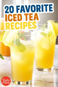 two glasses filled with iced tea sitting on top of a table