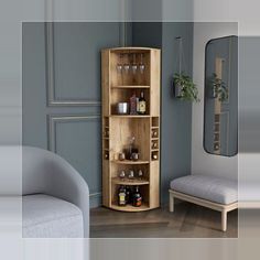 a wooden cabinet with glasses on it next to a couch and mirror in a room