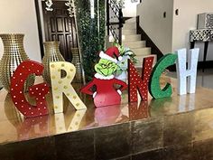 the grino letters are sitting on top of a table in front of a staircase