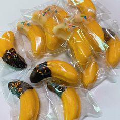 some bananas are wrapped in plastic and have sprinkles on them to look like they're eating