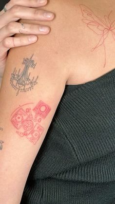 a woman's arm with tattoos on it