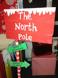 the north pole sign has been decorated with candy canes