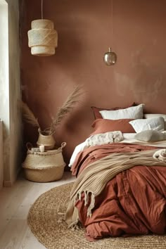 a bed in a bedroom with brown walls and white pillows on the bottom half of it