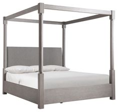 an image of a bed that is in the middle of white sheets and linens