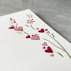 a card with hearts and flowers on it