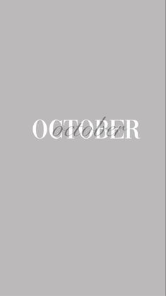 the word october written in white on a gray background