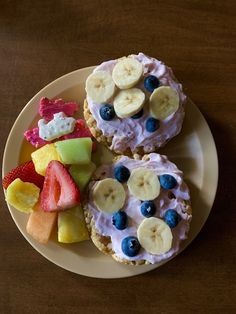 two pastries with fruit on them are sitting on a plate