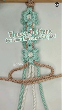 the flower pattern for this macrame project is made with two ropes and yarn