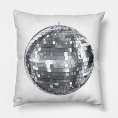 a black and white photo of a pillow with a disco ball design on the front