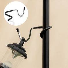 an image of a lamp that is on the side of a pole with a hook