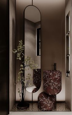 a bathroom with a mirror, stool and plant in it