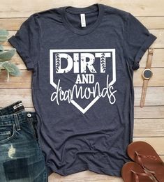 a t - shirt that says dirt and diamonds on it next to some jeans, sandals and