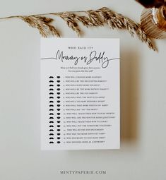 a wedding checklist on top of a table next to some dried flowers and leaves