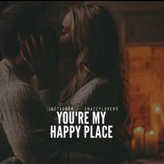 a man and woman kissing in front of candles with the words, you're my happy place