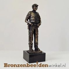 a bronze statue of a man in uniform