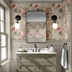 a bathroom with floral wallpaper and two sinks