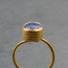 Handmade Blue Sapphire Ring, 24k Gold-Plated Brass Gemstone Ring, Adjustable Ring, Statement Sapphire Jewelry, Gift for Her Ring An elegant handmade ring with a natural faceted dark blue sapphire. The ring band and the bezel setting are made of 24 karats gold-plated brass. The ring is slightly adjustable Sapphire is September's lucky birthday stone and it is supposed to bring "Peace of Mind"   Ring band width 1.5 mm Blue Sapphire 9 mm approx. This is more of my Rings collection: http://www.etsy. Birthday Stone, Saphir Ring, Her Ring, Blue Sapphire Ring, Greek Jewelry, Blue Sapphire Rings, Sapphire Jewelry, Ring Collections, Everyday Jewelry