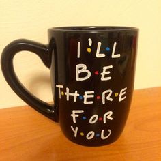 a black coffee mug with the words i'll be there for you on it