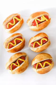 hot dogs with mustard and ketchup in buns