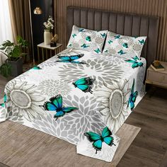 a bed with blue butterflies on it in a room