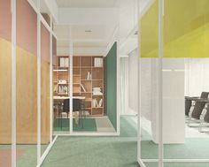 an office with green carpeting and white partitions to divide the room from the rest of the room