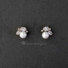 A classy little stud earrings designed with ivory glass pearls and topped with oval and tiny round cubic zirconia stones. A great style for any evening out! They are .5 inches long with post pierced backs. Rhodium or gold plated, AAA grade CZ, lead and nickel free. Bridesmaid Stud Earrings, Pearl Bridesmaid Earrings, Tiny Jewelry, Pearl Cluster Earrings, Silver Crystal Earrings, Bridesmaids Earrings, Blue Crystal Earrings, Heirlooms Jewelry, Pearl And Diamond Earrings