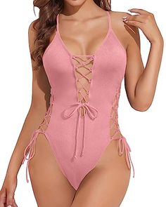 This slimming bathing suit provides moderate coverage and adds chic interest to your tropical beach look with its strappy lace up design.Featuring a sexy stripe at the front, strappy lace-up openings on the sides, a deep V-neck plunge, and an open... Beautiful Features, Flattering Swimsuits, High Waist Bottoms, Beach Look, Black Swimsuit, Tropical Beach