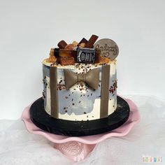 a birthday cake decorated with chocolate and candies