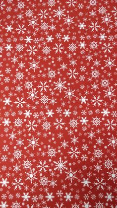 a red background with white snowflakes on it