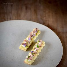 two pieces of cake sitting on top of a white plate