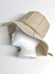 vintage ecru beige seamed panel raffia straw sun hat w/ pale sage grosgrain ribbon hatband trim elastic inner band & hatband 'Reggi of Wilshire' no size tag, fits small/medium 21 3/4 inch interior circumference excellent condition, no marks or flaws visible Cream Fitted Sun Hat With Flat Brim, Spring Khaki Fedora Hat, Lightweight Beige Travel Hat, Khaki Wide Brim Hat For Spring, Adjustable Cream Fedora Straw Hat, Cream Sun Hat For Spring Travel, Fitted Beige Brimmed Hat, Khaki Summer Hat For Spring, Summer Wide Brim Khaki Hat