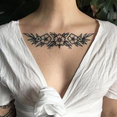 a woman with a tattoo on her chest