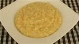 a bowl filled with oatmeal sitting on top of a checkered table cloth