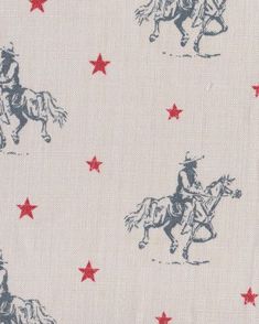 the fabric is white with red stars and a cowboy on a horse in the background