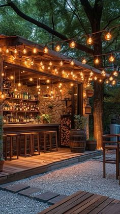 an outdoor bar is lit up with lights