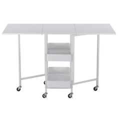 a white table with two shelves on wheels