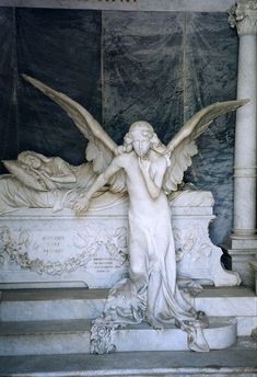 an angel statue sitting on top of a white marble bench in front of a column