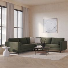 a living room scene with focus on the couch and coffee table in front of the window