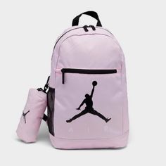 This Air Jordan Backpack In Pink Foam And Black Is Perfect For School Or Sports. With A Size Of 18 In X 12 In X 5 In, It Has Plenty Of Room For Your Belongings And Features Inner Dividers, Inner And Outer Pockets, And A Bottle Pocket. The Adjustable Straps And Top Handle Provide Comfort And Convenience, While The Solid Pattern And Jordan Character Family Make It A Stylish Accessory. This Backpack Is Made Of Polyester And Has A Fabric Lining, With A Zippered Closure And Accents. It Is Brand New W Sporty Pink Backpack For School, Sporty Pink School Backpack, Casual Pink Backpack For Back To School, Sporty Pink Standard Backpack, Functional Pink Backpack, Sporty Pink Backpack, Functional Pink Sports Backpack, Pink Sporty Standard Backpack, Pink Standard Backpack For Sports