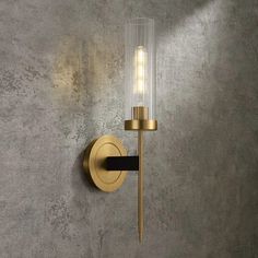 a wall light that is next to a concrete wall