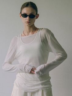 This is vanone atelier’s sheer fabric with a light transparency, providing just the right amount of sheerness without feeling too revealing. It has a silky and stretchy texture that drapes nicely over the body, offering a light and comfortable fit. The neckline is designed with a moderate width boat neck, adding to its airy and relaxed feel. Additionally, it can be paired with a sleeveless top made from the same fabric to create a coordinated set.- Perfect for everyday wear- Can be styled with various bottoms to create different looks- Versatile enough to complement any outfit Sheer Mesh Top For Layering, Sheer Sleeve Mesh Top For Layering, Sheer Mesh Fitted Top For Layering, White Sheer Mesh Top For Layering, Sheer Fabric, Sheer Fabrics, Boat Neck, Neck T Shirt, Sleeveless Top