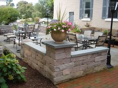 an outdoor patio with tables and chairs