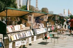 an outdoor book market with books on display