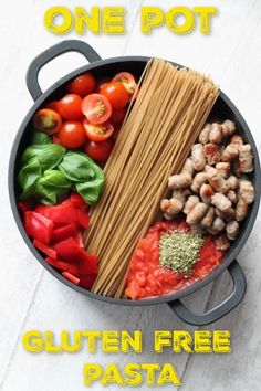 a pan filled with pasta, meat and vegetables