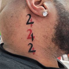 a man's ear with numbers on it