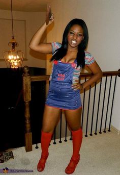 a woman in an apron and boots posing for the camera