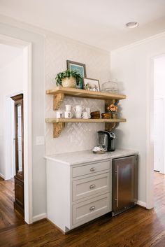 the kitchen is clean and ready to be used as a place for coffee or tea