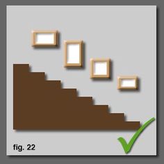 an image of stairs going up the side of a wall with frames on it and green tick mark below