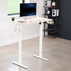 a computer desk with a monitor and keyboard on it