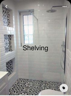 a white bathroom with black and white tile on the floor, shower stall and toilet